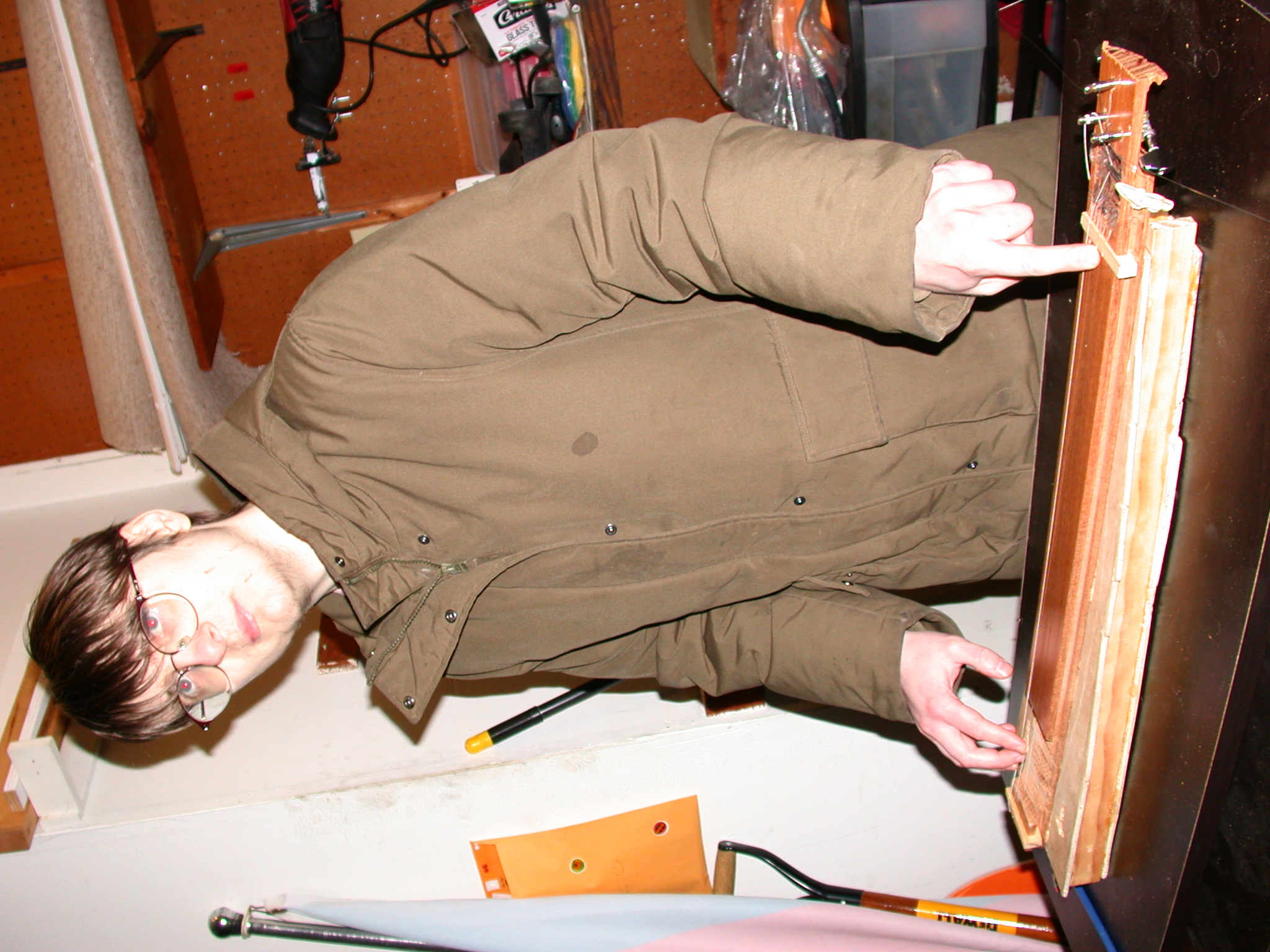 Author playing one of their handmade instruments.
