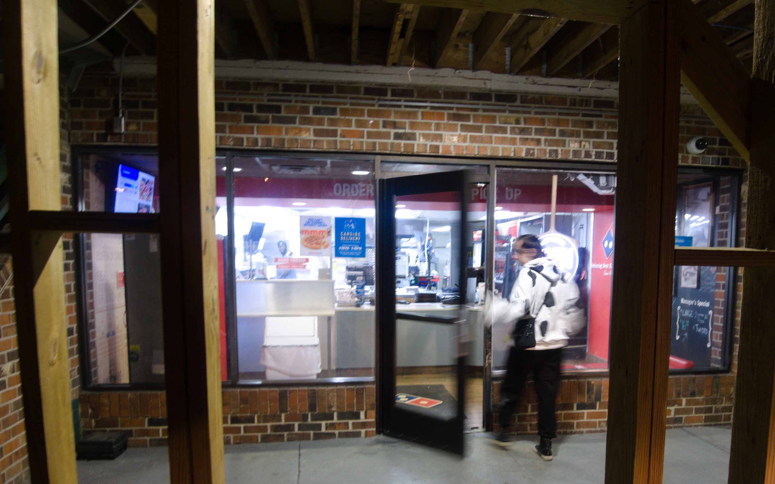 puzzle stepping into a pizza parlor.