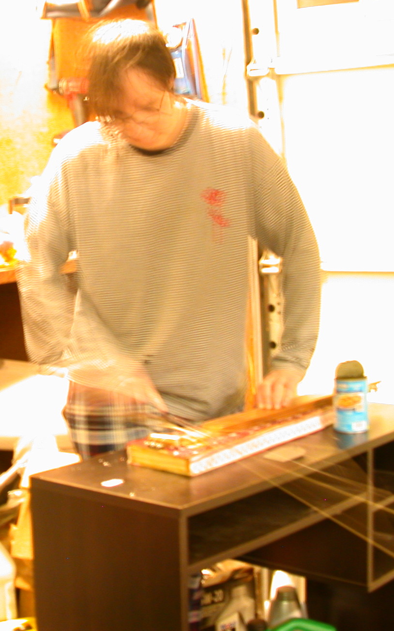 puzzle bowing the decorated instrument.